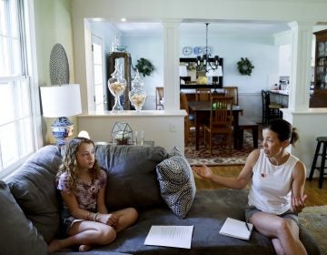 In this Thursday, May 3, 2018 photo, Sandy Nissenbaum, (right), and her daughter, Nora Nissenbaum, 12, talk during an interview with The Associated Press in Wayne, Pa. The case of a suburban Philadelphia boy who was quietly allowed to return to class after being accused of making a shooting threat has thrown a spotlight on the hard decisions school authorities must make. Nora Nissenbaum who says the boy bullied her has withdrawn from class for fear of him. (Matt Slocum/AP Photo)