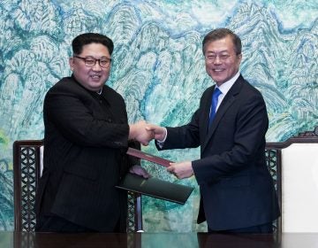 In this April 27, 2018 file photo, North Korean leader Kim Jong Un, (left), and South Korean President Moon Jae-in shake hands after signing on a joint statement at the border village of Panmunjom in the Demilitarized Zone, South Korea. The two Koreas will hold a high-level meeting on Wednesday, May 16, 2018, to discuss setting up military and Red Cross talks aimed at reducing border tension and restarting reunions between families separated by the Korean War. (Korea Summit Press Pool via AP, File)