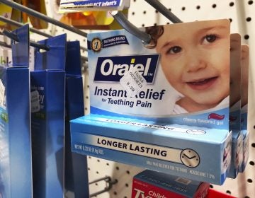 Orajel is displayed for sale in a pharmacy in New York Wednesday, May 23, 2018. The US Food and Drug Administration is warning parents about potentially deadly risks of teething remedies that contain a numbing ingredient used in popular brands like Orajel. The agency on Wednesday said it wants manufacturers to stop selling products intended for babies and toddlers because the products contain a drug ingredient that can cause a rare but dangerous blood condition that interferes with normal breathing. (Stephanie Nano/AP Photo)