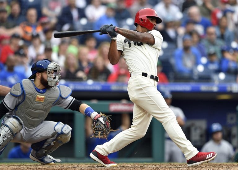Philadelphia Phillies' Nick Williams hits a RBI single off Toronto Blue Jays' J.A. Happ to score Aaron Altherr during the sixth inning of a baseball game, Sunday, May 27, 2018, in Philadelphia. The Blue Jays won 5-3.