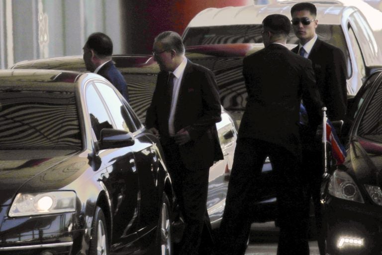 Kim Yong Chol, left, a former military intelligence chief who is now North Korean leader Kim Jong Un's top official on inter-Korean relations, accompanied by North Korean Ambassador to China Ji Jae Ryong, second from left, arrives at Beijing Capital International Airport in Beijing, Wednesday, May 30, 2018. Kim Yong Chol was headed to New York for talks with U.S. Secretary of State Mike Pompeo. (AP Photo/Andy Wong)