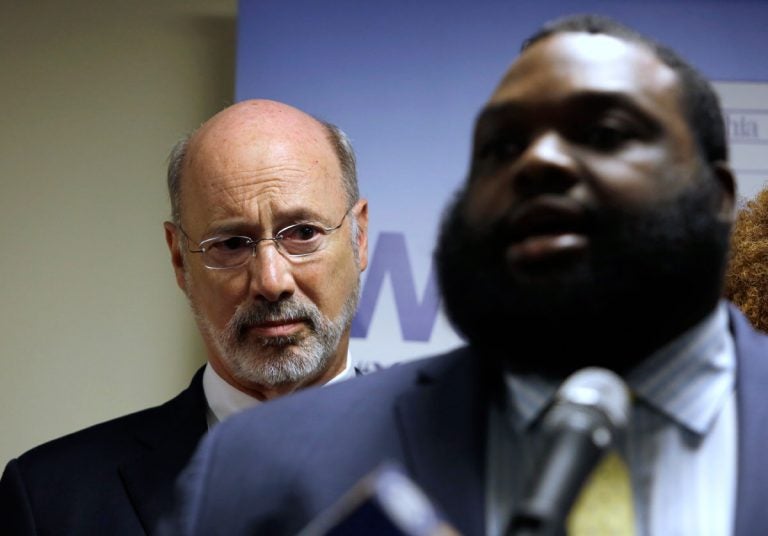 Pennsylvania Gov. Tom Wolf, left, listens to state Rep. Jordan Harris (D-Phila.) during a news conference Tuesday, May 8, 2018, in Philadelphia. Wolf announced a $1.5 million grant program aimed at reducing gun violence around the state. Wolf unveiled the Gun Violence Reduction Initiative Tuesday and Pennsylvania Commission on Crime and Delinquency is accepting applications for the grants and will start awarding them in early July. (Jacqueline Larma/AP Photo)