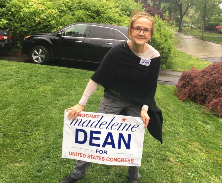 Madeleine Dean plants lawn sign in Cheltenham Township  (Dave Davies/WHYY)