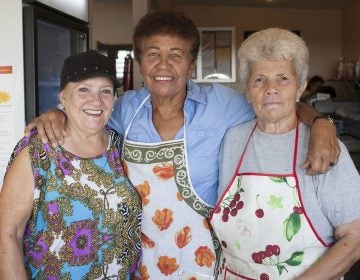 A group of women in the community of Mariana, in Puerto Rico, meet everyday to cook for their neighbors. They say after the storm, the work and camaraderie have eased depression. (Irina Zhorov/WHYY)