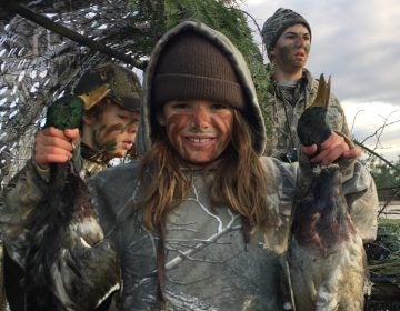 Linde Lemerond proudly shows off a couple of the ducks that her brother, Nash, and their friend, Tanner Kocker, shot last fall. (Courtesy of Joe Lemerond)