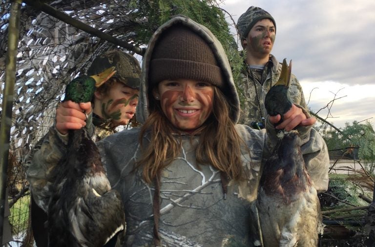 Linde Lemerond proudly shows off a couple of the ducks that her brother, Nash, and their friend, Tanner Kocker, shot last fall. (Courtesy of Joe Lemerond)