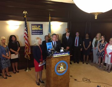 Delaware Gov. John Carney and Lt. Gov. Bethany Hall Long announce a three-year action plan to combat addiction and address mental health issues. (WHYY/Paul Parmalee)