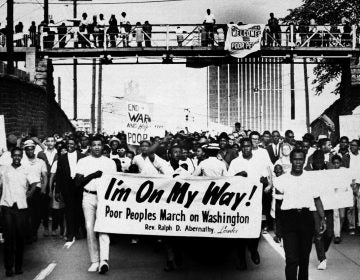 Sign-carrying participants march on the southern leg of the Poor People's Campaign May 10, 1968, in Atlanta. (AP file photo)