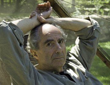 Famed novelist Philip Roth sits inside a screened tent at his home on Sept. 5, 2005, in Warren, Conn. Roth died on Tuesday. He was 85. (Douglas Healey/AP)