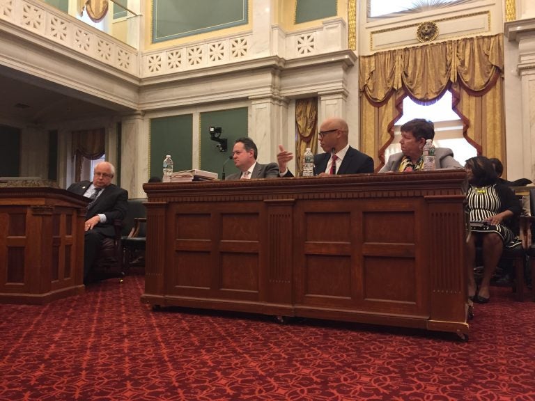 SRC member Marjorie Neff (from right), Philadelphia School District Superintendent William Hite, district CFO Uri Monson, and Councilman Al Taubenburger take part in a Wednesday budget hearing. (Avi Wolfman-Arent/WHYY)