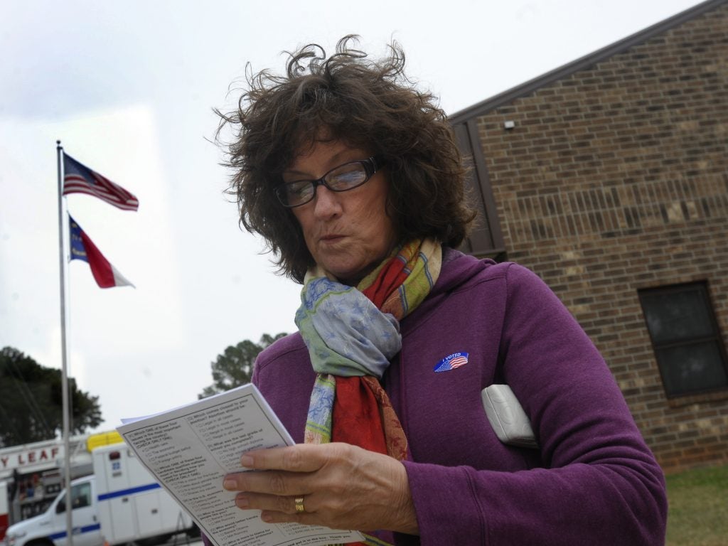 Jan Raynor fills out an exit poll conducted by Edison Research after casting her ballot at the Bayleaf Volunteer Fire Department on Nov. 6, 2012 in Raleigh, N.C.