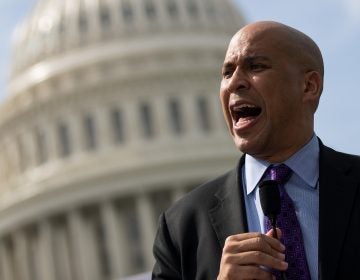 Sen. Cory Booker (D-NJ) speaks during a September 2017 news conference. Booker has released plan that would establish job guarantee programs in 15 communities. (Drew Angerer/Getty Images)