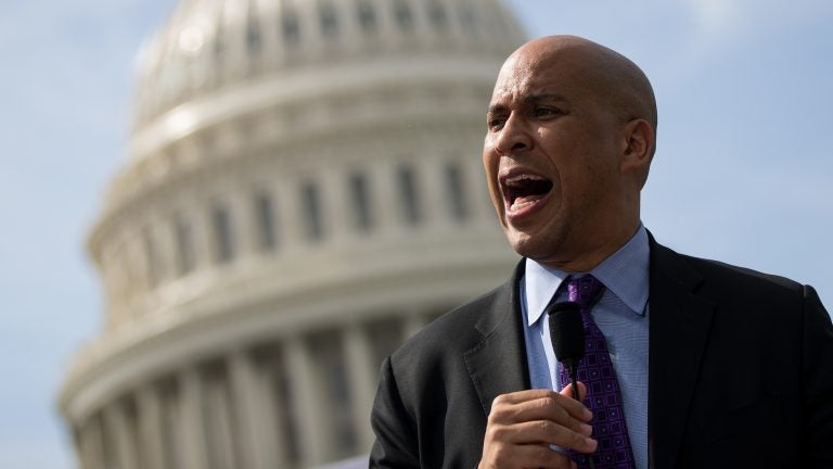 Sen. Cory Booker (D-NJ) speaks during a September 2017 news conference. Booker has released plan that would establish job guarantee programs in 15 communities. Sen. Cory Booker (D-NJ) speaks during a September 2017 news conference. Booker has released plan that would establish job guarantee programs in 15 communities. (Drew Angerer/Getty Images)