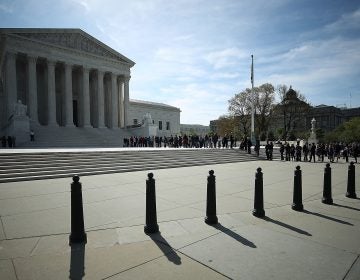 People wait in line to enter the U.S. Supreme Court last month. The court sided with businesses not allowing class-action lawsuits for federal labor violations.