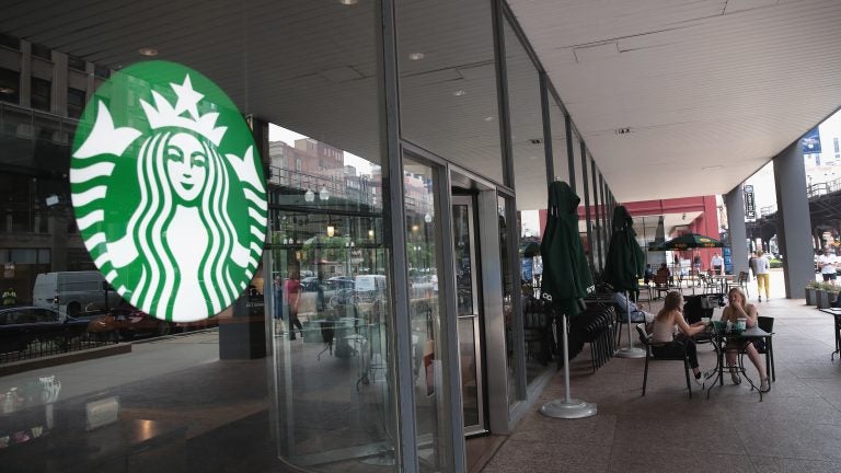 Customers sit on the patio of a Chicago Starbucks store after it was closed on May 29.