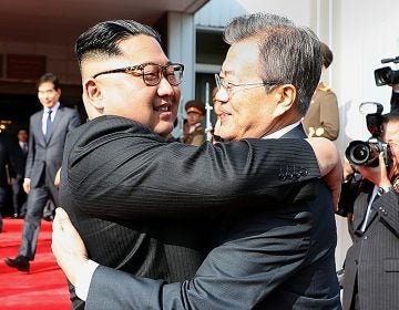 North Korean leader Kim Jong Un (left) and South Korean President Moon Jae-in embrace Saturday on the North Korean side of the shared inter-Korean area of Panmunjom. (Handout/South Korean Presidential Blue House/Getty Images)