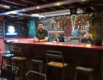 Owner JP Teti stands behind the basement bar at Passyunk Avenue, a Philly-themed dive bar in London