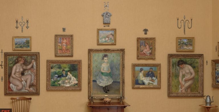 The west wall of Room 13 at the Barnes Foundation is covered with Renoir paintings.