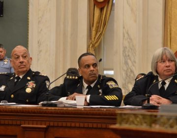 Philadelphia Police Commissioner Richard Ross (center) and deputies at City Council hearing (Tom MacDonald/WHYY)