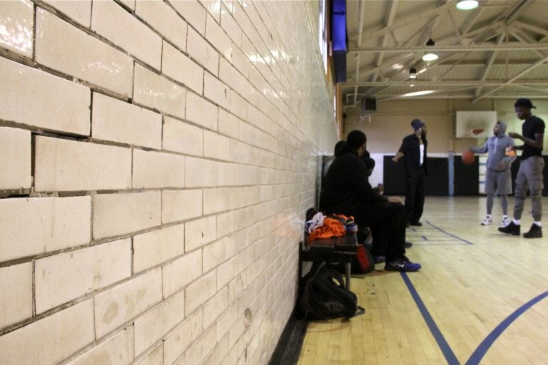 Young men gather for an afternoon basketball game at Vare Recreation Center. (Emma Lee/WHYY)