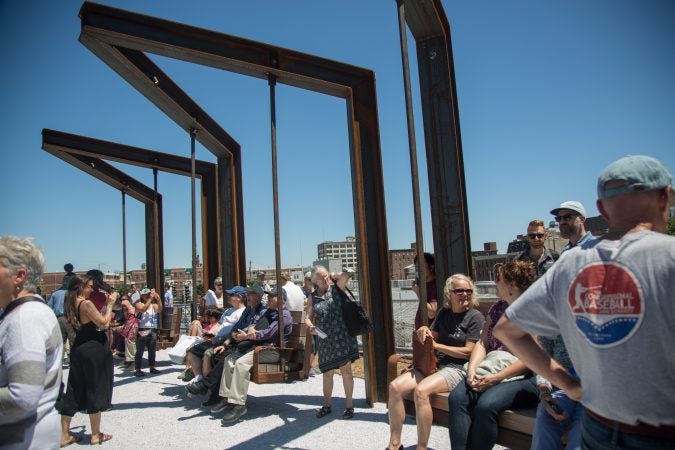 Industrial styled swings sit at the end of the first quarter mile of the Philadelphia Rail Park. (Emily Cohen for WHYY)