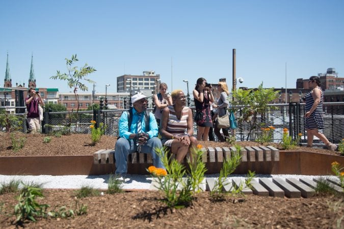 Benches and greenery populate the new park giving Philadelphians and visitors a new place to view the city from. (Emily Cohen for WHYY)