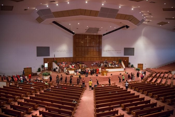 More than 100 faith singers and performers from across Philadelphia gather at Deliverance Evangelical Church in North Philadelphia on June 25 to rehearse for their gospel concert at Independence Hall as part of this year’s Wawa Welcome America celebration. (Emily Cohen for WHYY)