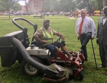 Scott Wagner in Malcolm X Park post-cleanup, accompanied by a contractor, supporter and lawnmower. (Photo by Wagner Campaign)