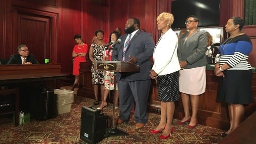 Representatives Jordan Harris and Carol Hill-Evans stand with the Grandview Five — the name the women involved in the golf course incident have given themselves. Jordan said he is 