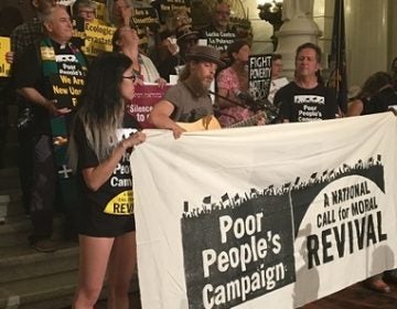 Demonstrators speak and play guitar at the last of six Poor People's Campaign rallies. (Katie Meyer/WITF)