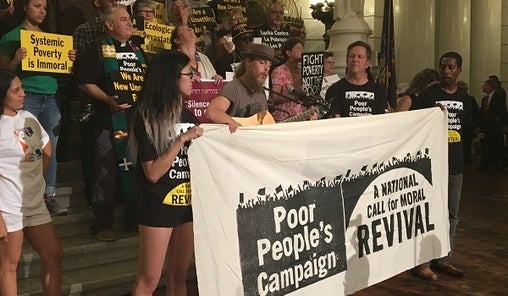 Demonstrators speak and play guitar at the last of six Poor People's Campaign rallies. (Katie Meyer/WITF)