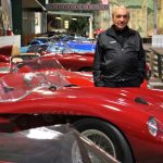 Dr. Fred Simeone stands amid his collection at the Simeone Foundation Automotive Museum, which traces the history of auto racing and emphasizes the value of competition as a spur to progress. (Emma Lee/WHYY)