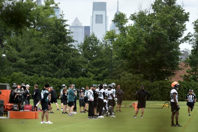 With Center City skyline seen as backdrop the Philadelphia Eagles practice at the NovaCare Complex in South Philadelphia a day after the canceled invite to the Super Bowl Championship celebration at the White House. (Bastiaan Slabbers for WHYY)