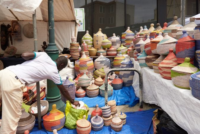 A vendor lines the street with handmade baskets from Senegal, West Africa, at the 2018 Odunde Festival in Philadelphia. (Natalie Piserchio for WHYY News) 