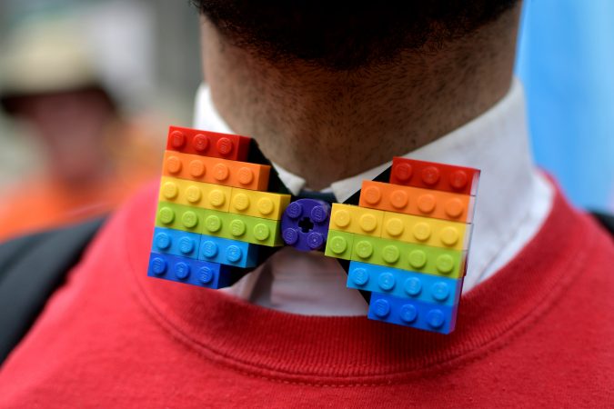 Micheal Assetto, of Ardmore, Pa., dons a homemade rainbow Lego tie as he participates with the Target delegation, during Philadelphia's 30th annual PrideDay parade on Sunday, June 10, 2018. (Bastiaan Slabbers for WHYY)