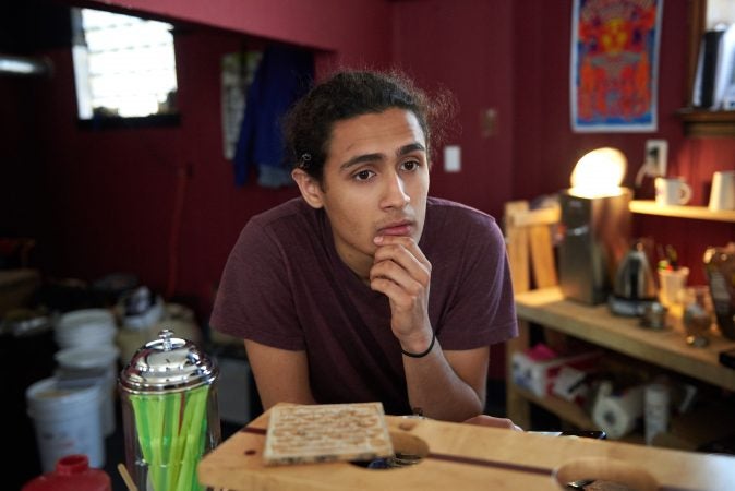 Mohammad Wiswall of Trenton, N.J., was at the Art All Night festival with his friends on Saturday night, but left before the shooting occurred. He woke up to the news on Sunday morning before coming in to work at his father’s coffee shop, Trenton Coffeehouse. (Natalie Piserchio for WHYY)