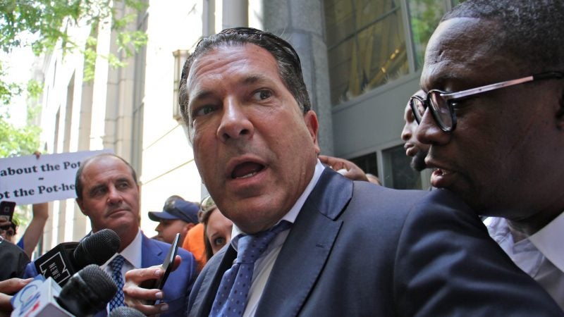 Meek Mill's lawyers Brian McMonagle (left) and Joe Tacopina (center) leave the courthouse after asking Judge Genece Brinkley for a new trial on a 10-year-old gun and drug conviction. (Emma Lee/WHYY)