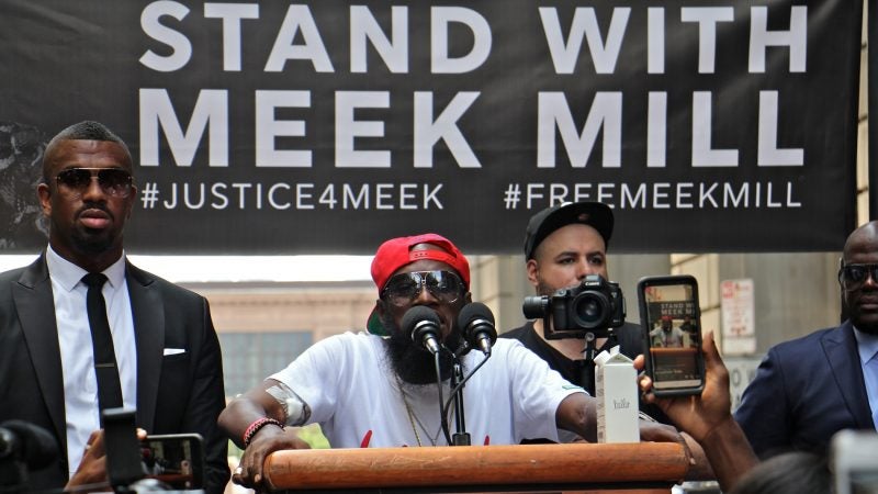 North Philadelphia rapper Leslie Edward Pridgen, better known by his stage name Freeway, speaks in support of Meek Mill at a rally outside the Criminal Justice Center. (Emma Lee/WHYY)