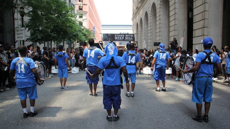 The West Powelton Drill Team performs outside the Juanita Kidd Stout Center for Criminal Justice in support of Philadelphia rapper Meek Mill. (Emma Lee/WHYY)