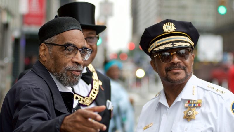 Kenneth Gamble and Sheriff Jewell Williams converse ahead of the annual Juneteenth parade through Center City. (Bastiaan Slabbers for WHYY)