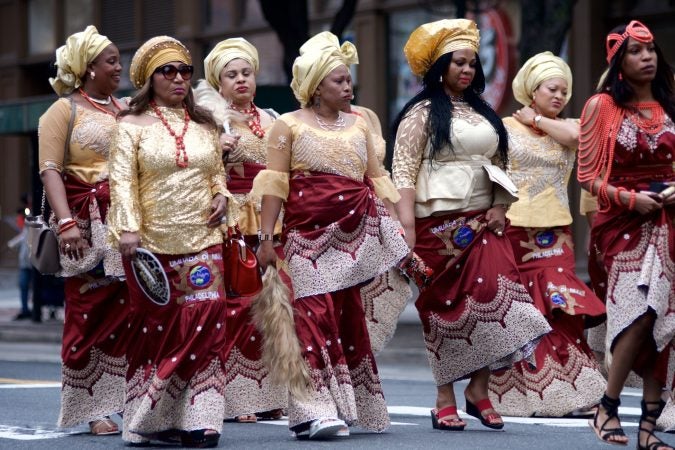 Marchers make their way through Center City during the annual Juneteenth parade on Saturday. (Bastiaan Slabbers for WHYY)