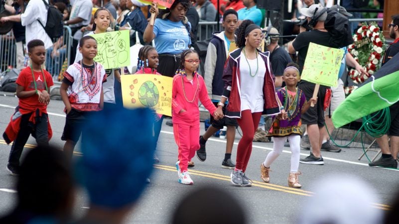 A group promoting the Lest We forget Slavery Museum participates in the annual Juneteenth parade through Center City on Saturday. (Bastiaan Slabbers for WHYY)