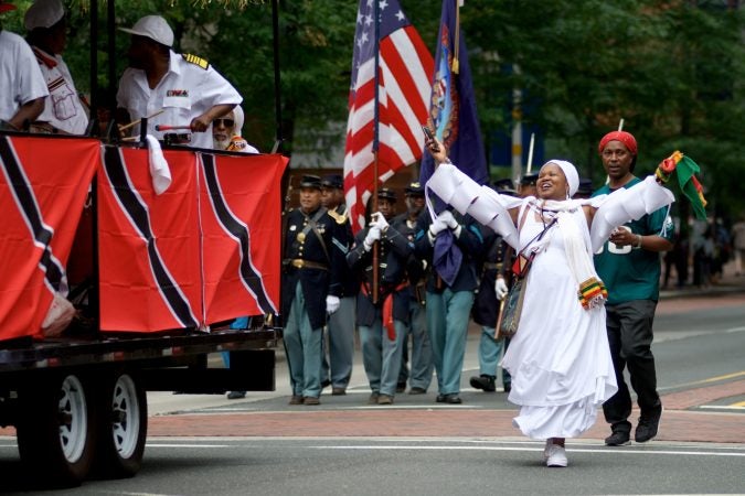 Marchers make their way through Center City during the annual Juneteenth parade on Saturday. (Bastiaan Slabbers for WHYY)