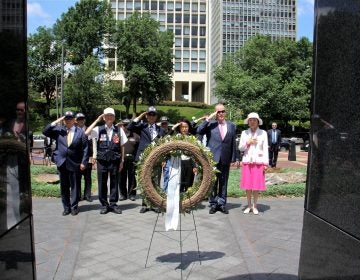 Veterans and dignitaries, including political consul Yoon Jung Kim of the Republic of Korea, place a wreath in front of the Korean War Memorial at Penn's Landing during a ceremony held annuallly on the anniversary of the start of the war.