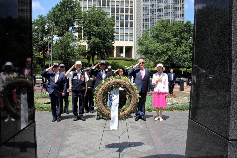 Veterans and dignitaries, including political consul Yoon Jung Kim of the Republic of Korea, place a wreath in front of the Korean War Memorial at Penn's Landing during a ceremony held annuallly on the anniversary of the start of the war.