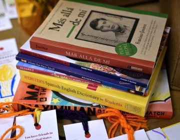 At Mighty Writers El Futuro in South Philadelphia, children donate books and make bookmarks for kids and immigrant families held at the Berks County Detention Center. (Bastiaan Slabbers for WHYY)