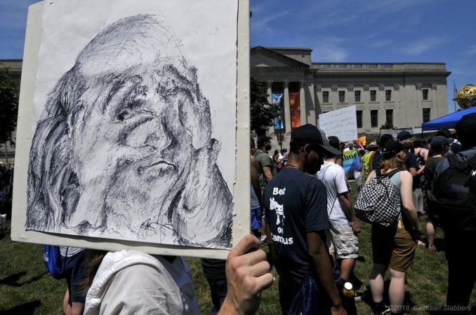 Ian Connito said drew this sign depicting a Benjamin Franklin feeling ashamed in an hour. Thousands came out to a protest immigrant family detention Saturday in Philadelphia. (Bastiaan Slabbers for WHYY)