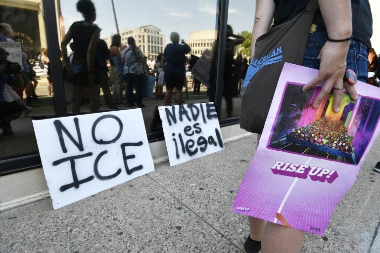 Protesters rally at the U.S. Immigration and Customs Enforcement field office at 8th and Cherry streets after a rally in Philadelphia on June 30. (Bastiaan Slabbers for WHYY)