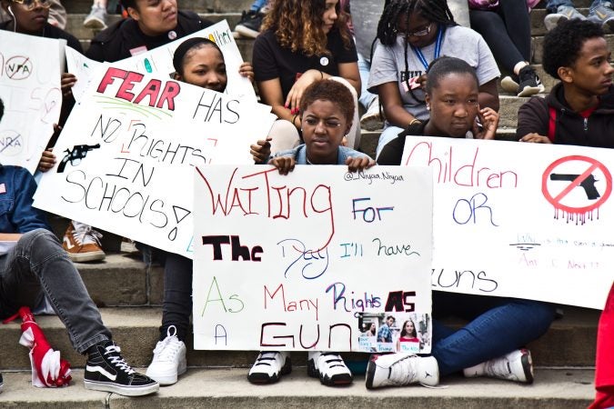 Niyaa Dupree, 16, (center) said she came to the rally against gun violence because of how firearms have affected her life. (Kimberly Paynter/WHYY)