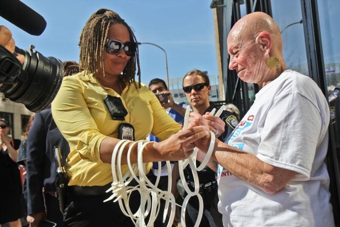 A senior citizen's group called The Old Farts were arrested in front of Philadelphia’s ICE headquarters Friday morning in protest of the Trump administration’s family separation policy. (Kimberly Paynter/WHYY)